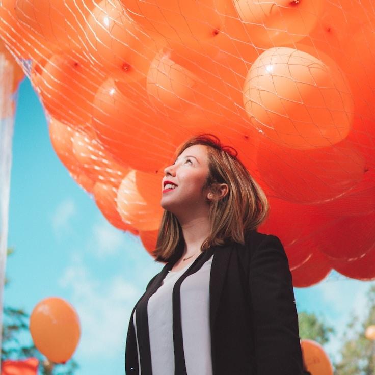 Alex Rivera, Lead Design Curator at Gentle Dawn Route, reviewing corporate floral arrangements